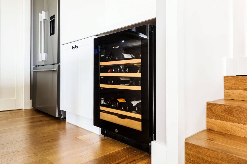 custom wine fridge in a hamptons style kitchen